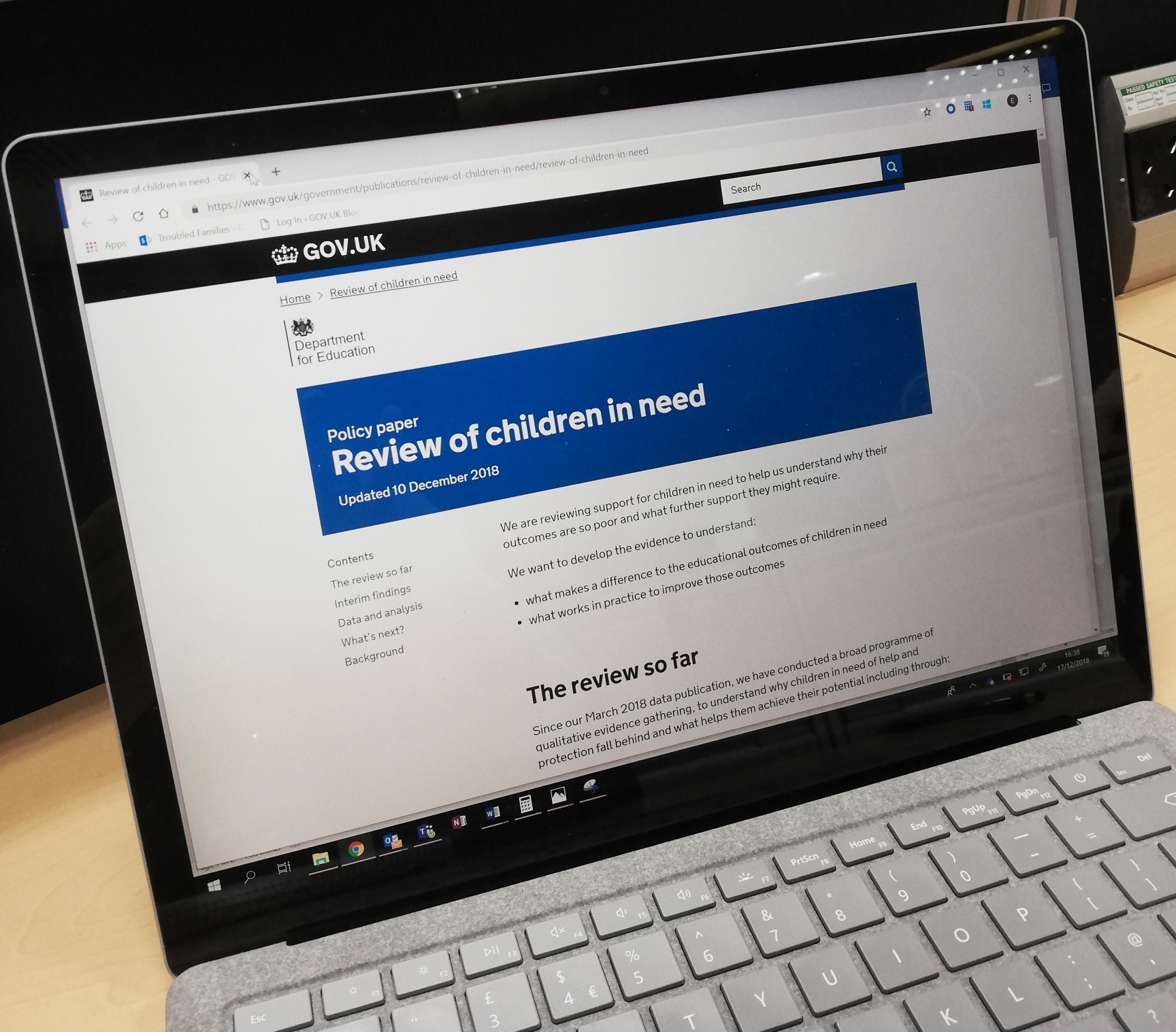 Photo of a laptop with the review of children in need displayed on the screen